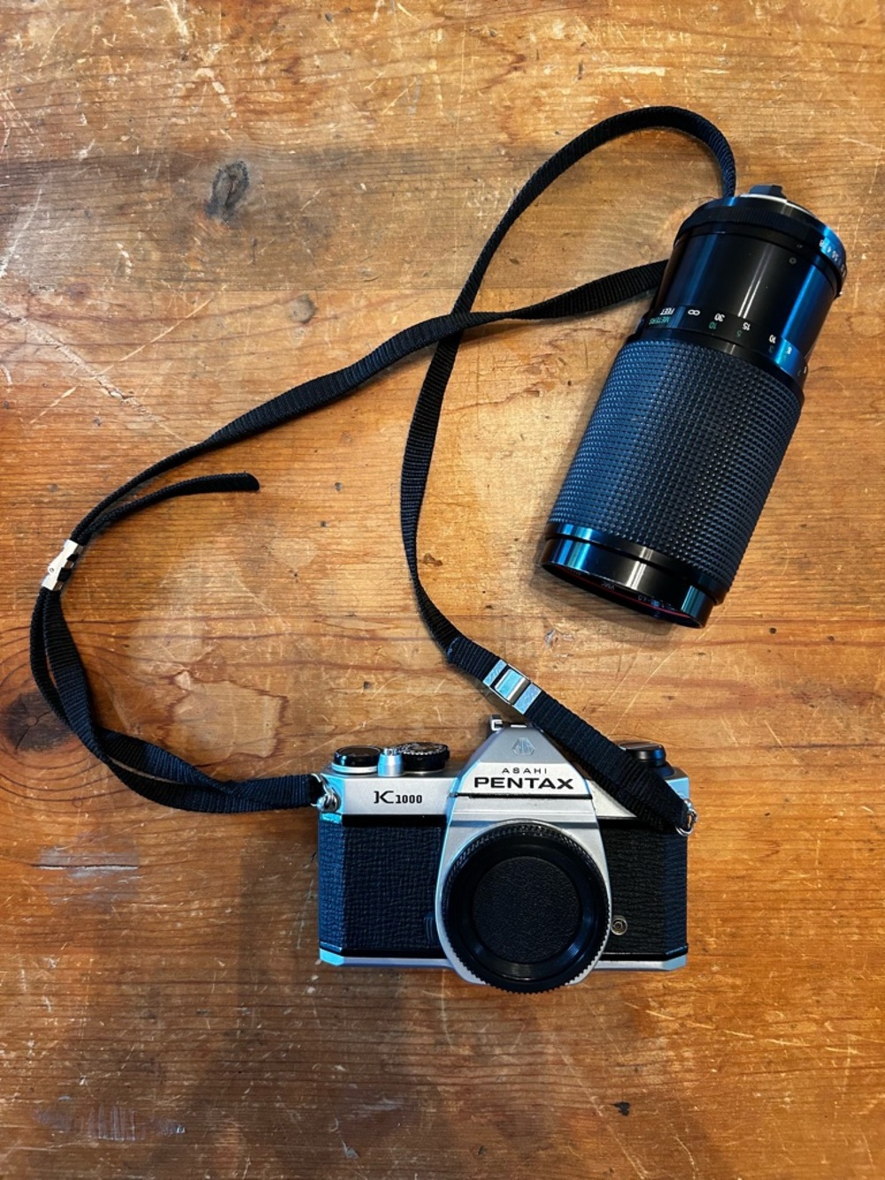 Asahi PENTAX K1000 SLR 35mm camera and Vivitar Series 1 macro-focusing zoom.
